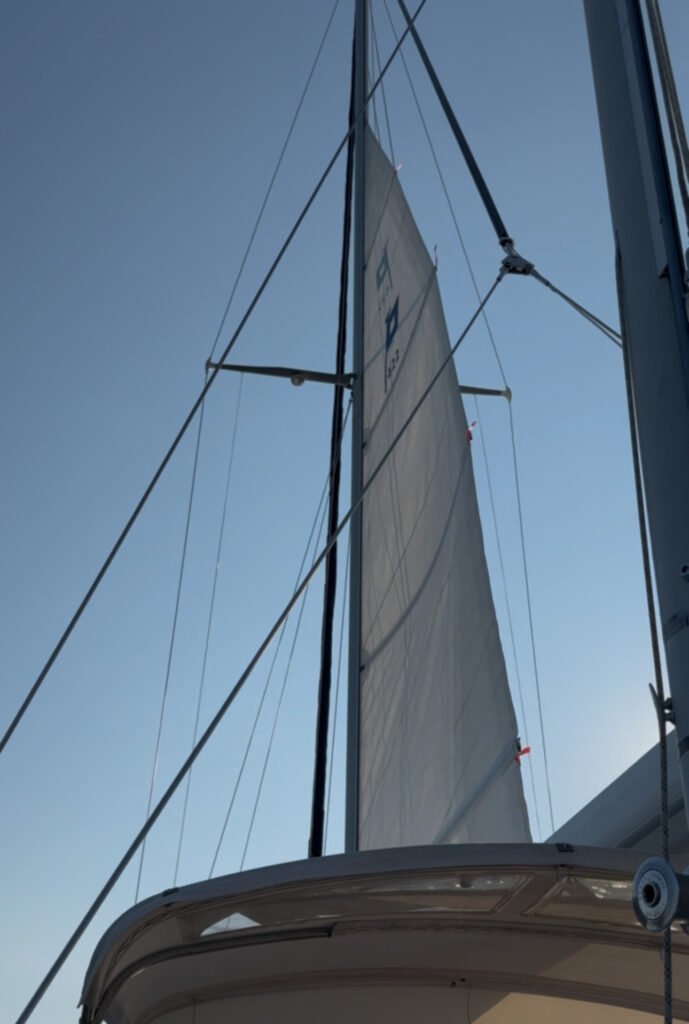 Half of mainsail Mainsail of a private yacht half way up the mast as the wind sails the boat through the waters of Martha's Vineyard on a private sailing charter