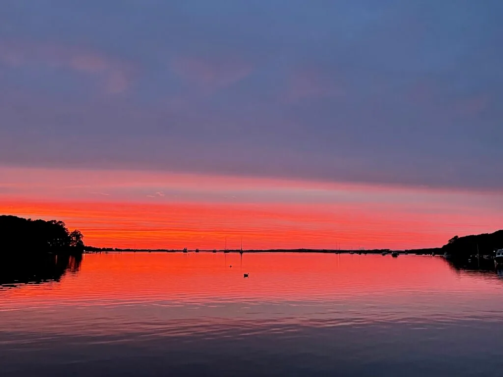 Sunset over Vineyard Sound from the deck of a private sailing charter